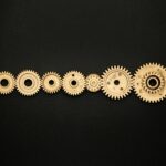 photo of golden cogwheel on black background