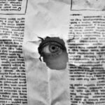 eye on a hole in a paper