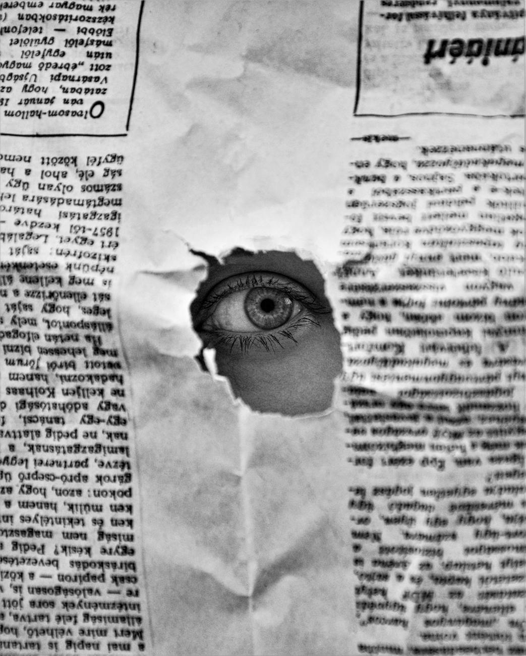 eye on a hole in a paper