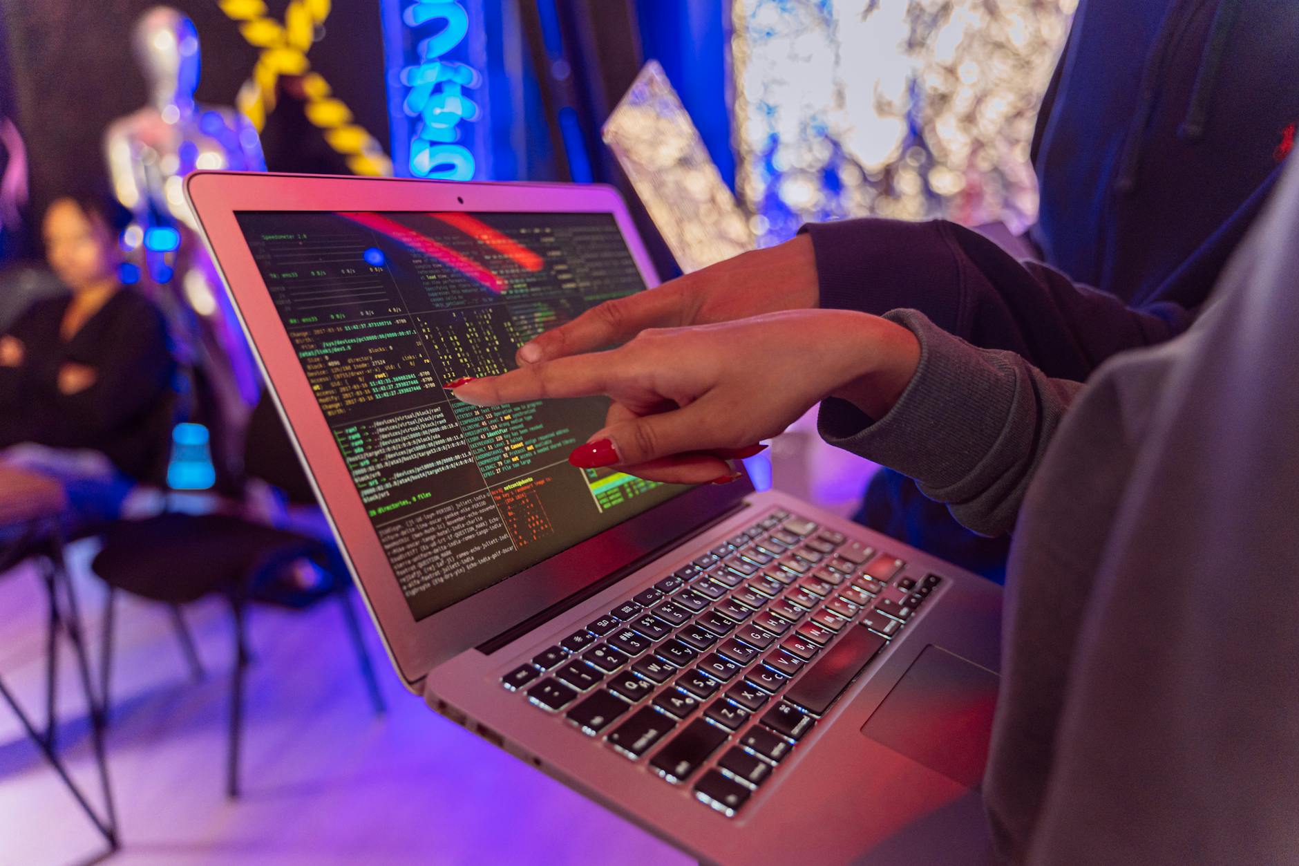 person using macbook air on table